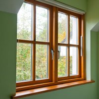 Double glazed wooden window frame in the home in the autumn